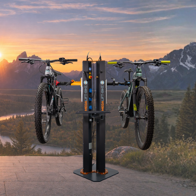 Electric bike repair stand with two workstations Electric bike repair stand with two workstations holding mountain bikes in scenic mountain landscape at sunrise